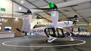 White electric aircraft with rotors on display