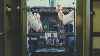 Pilot and co-pilot in the cockpit